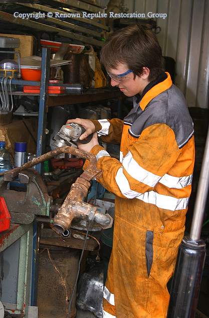 Chris Bodell wire brushing turbo oil piping